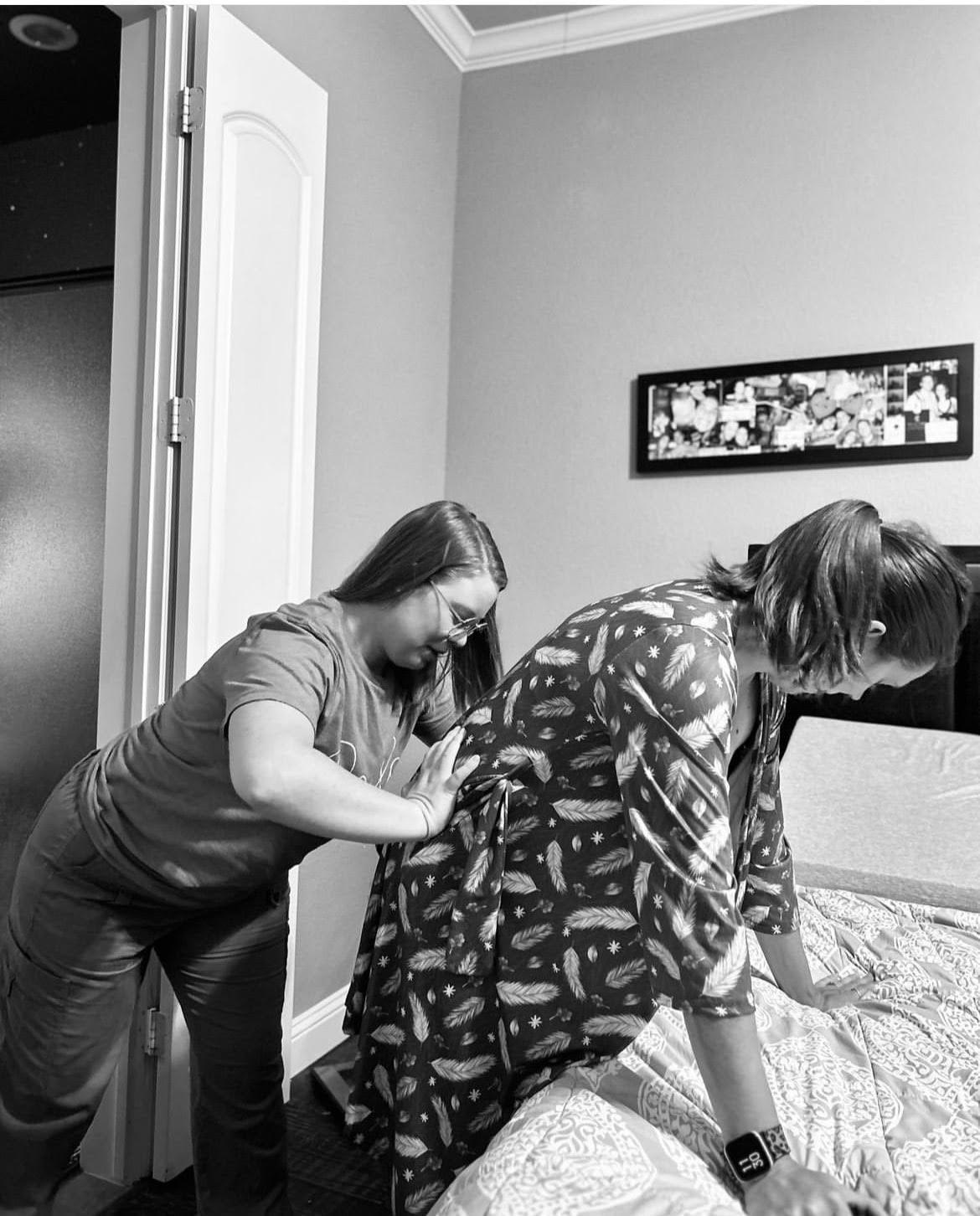 Mackenzie applying counter-pressure to a laboring mother's lower back