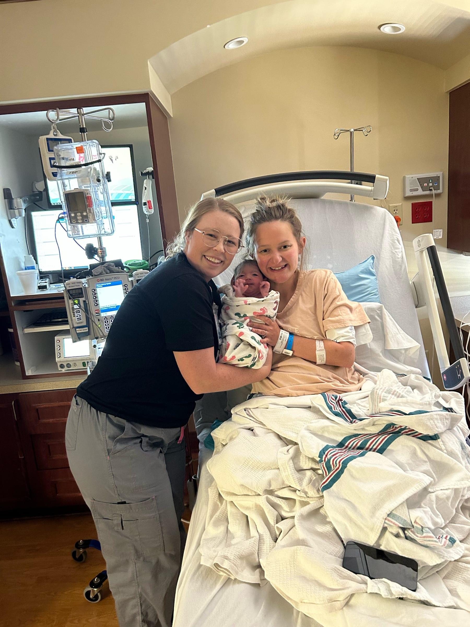 Mackenzie with Eden and her newborn in the hospital