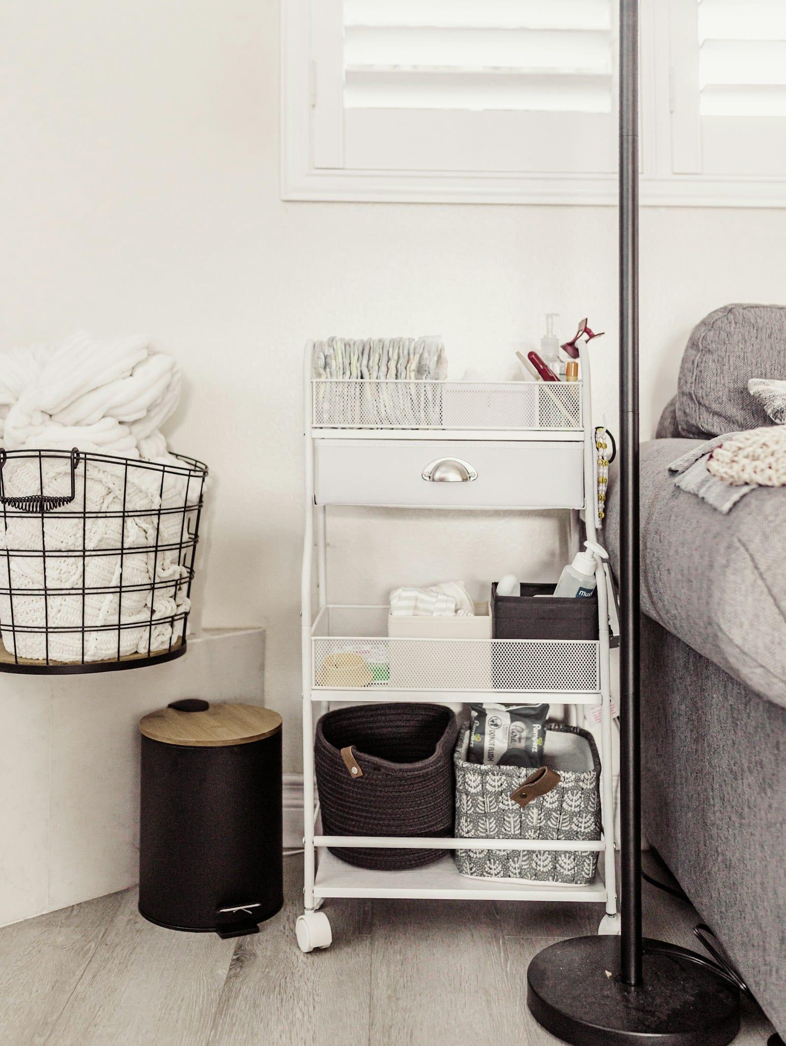 A tidy nursery cart stocked with baby supplies